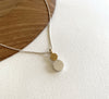 This little ‘double dot’ pendant is a play on size, colour and detail. Made from 925 sterling silver, the pendant has a gold vermeil highlight at top. Both dots have tiny dash lines decorating their matt finish surfaces